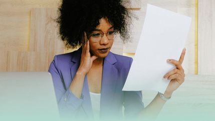 PML, Business woman reading document.jpg