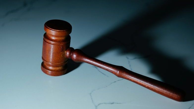 Auctioneer's gavel on a marble surface