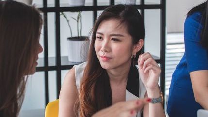 Business woman listening to colleague