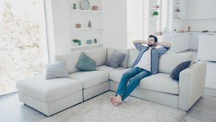 Man relaxing on sofa