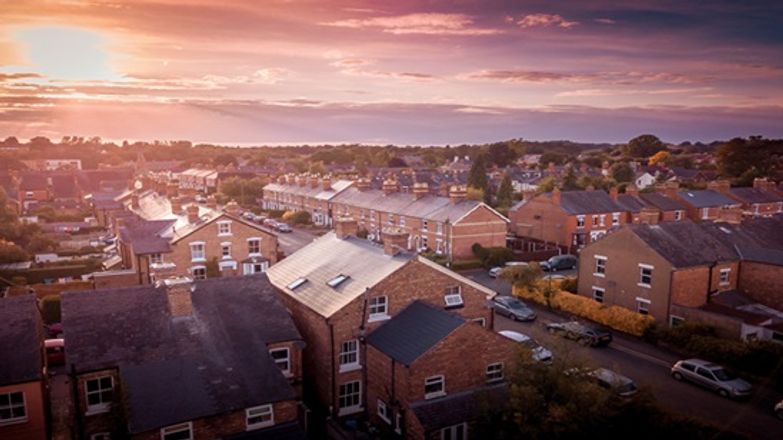 Sun setting on British houses AdobeStock_266182040.jpeg