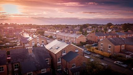 Sun setting on British houses AdobeStock_266182040.jpeg