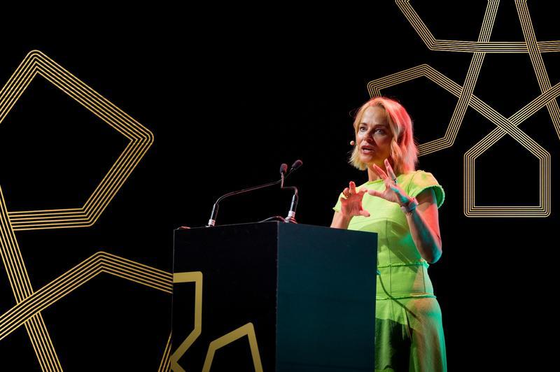 Daisy McAndrew with PMOne backdrop.jpg.jpg