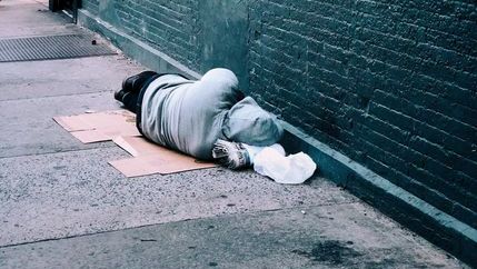 homeless lying on floor.jpg