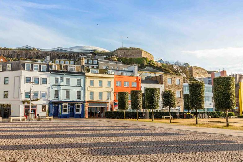 St Helier square with Fort Regent in the background