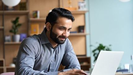 Asian Man with beard on laptop