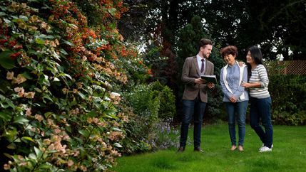 Mother and daughter viewing a garden