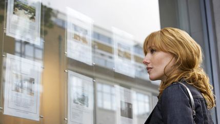 Lady looking in branch window