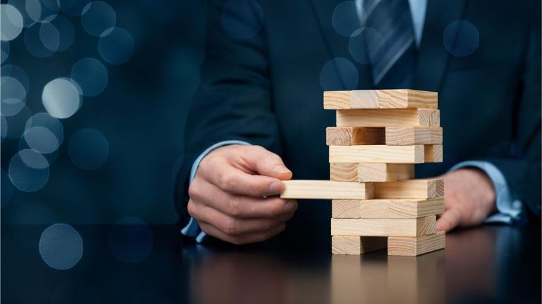 Risk managment, wooden block stack