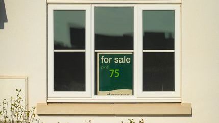 For sale sign in window