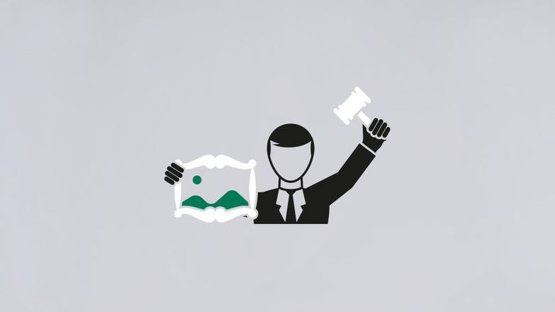 Auctioneer holding painting graphic