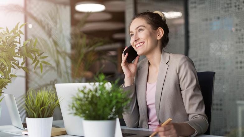 Person at desk on the phone