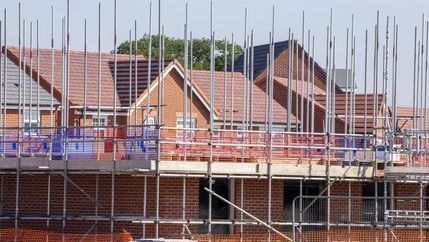 New build properties with scaffolding around them