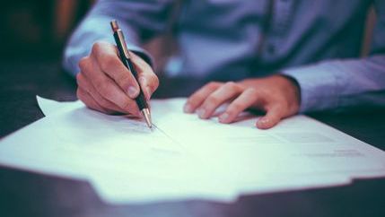 Man writing on paper
