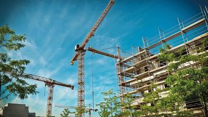 Cranes building a high-rise block