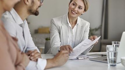 Agent going through a contract with a couple