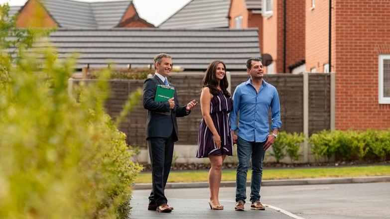 Agent showing couple properties