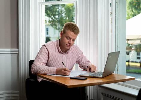 Man studying for qualification on laptop