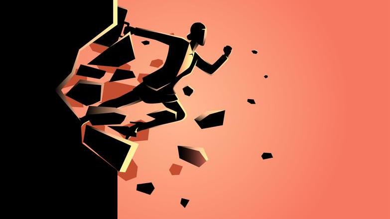 Business woman smashing through wall