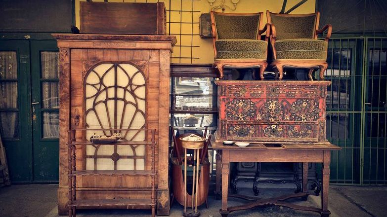 Collection of old wooden furniture at a dealer's shop