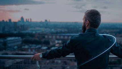 Connect, Business man looking over cityscape.jpg
