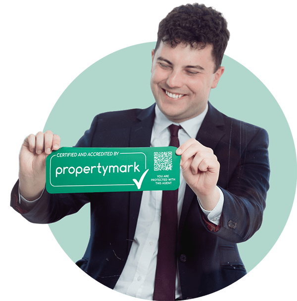 George in suit holding logo.png