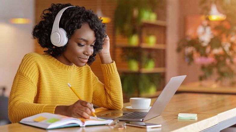 Woman studying in yellow top