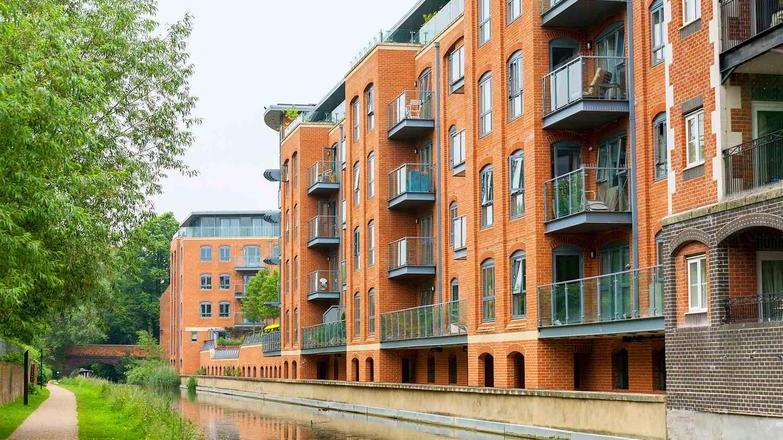 Low rise apartment block by canal