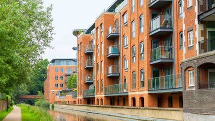 Low rise apartment block by canal