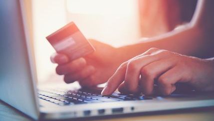 Online ourchase using credit card and laptop