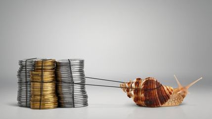 Snail with harness slowly pulling collums of coins along