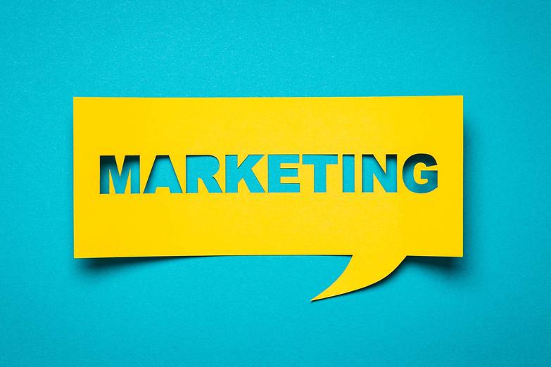 Marketing lettering cut out from brightly coloured paper
