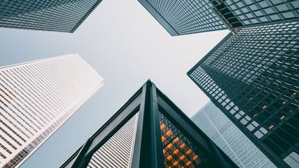 Looking up between 5 skyscrapers
