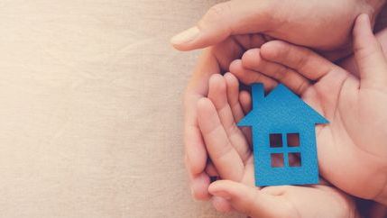 Hands holding blue house.jpg