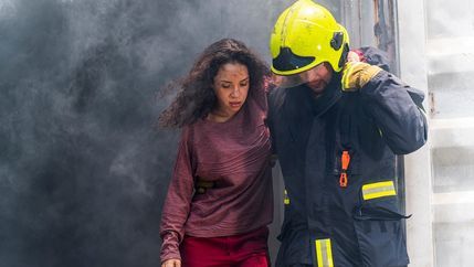 Firefighter rescue from a burning building.jpg