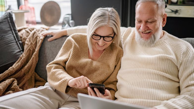 Mid-life couple on sofa (Canva).jpg